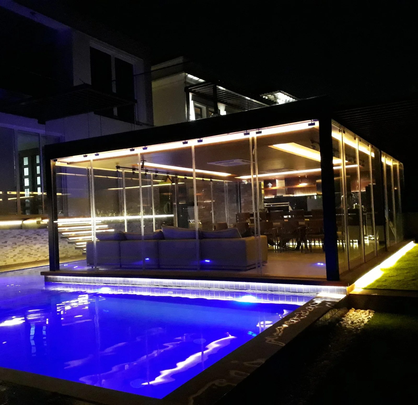 Pool light after dark by Jorge Rangel Interiors, design — industrial