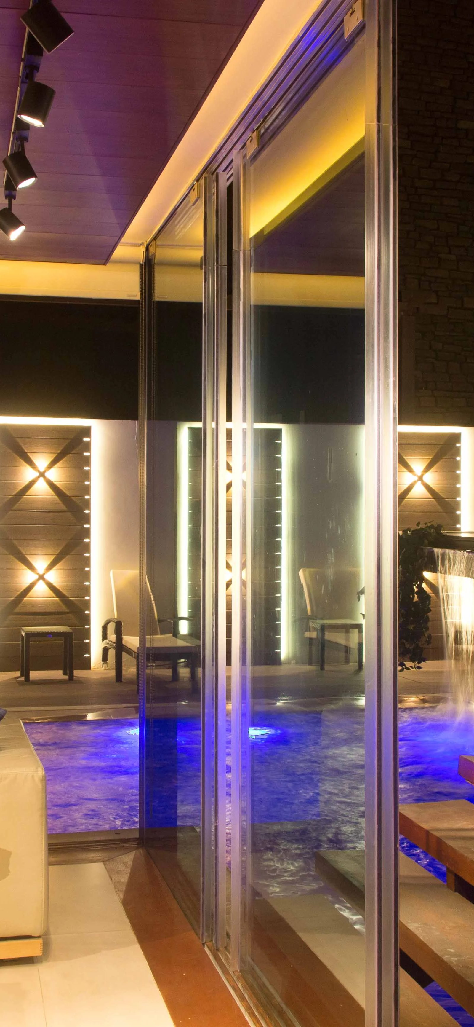 Pool light through glass by Jorge Rangel Interiors, design — industrial